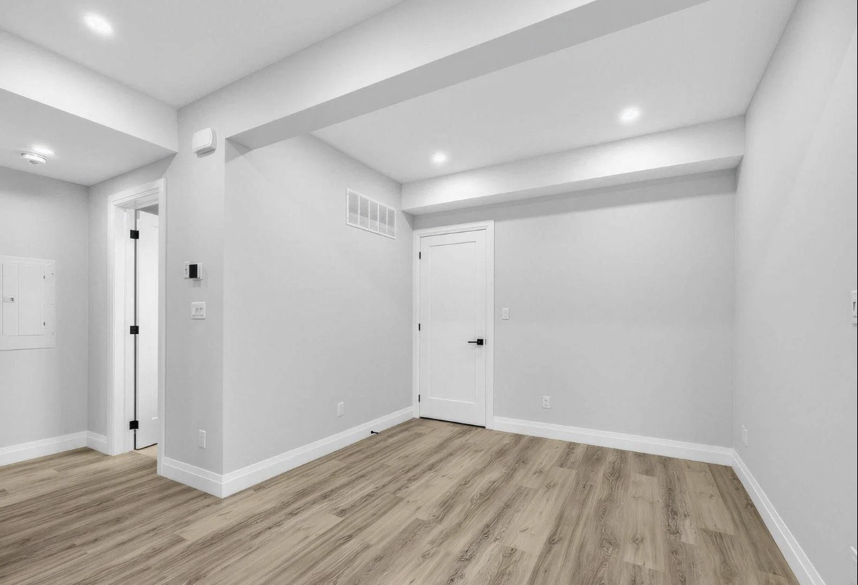 Empty bedroom with light flooring