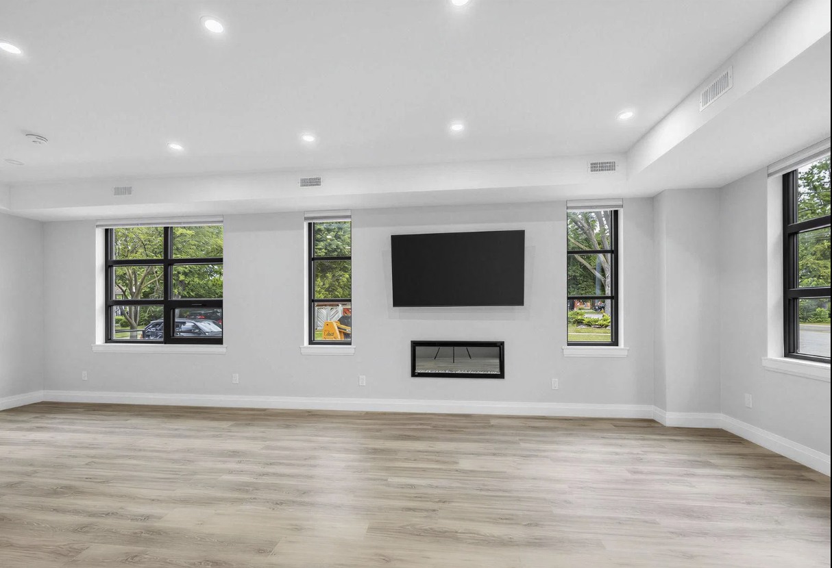 Living room with fireplace and large windows